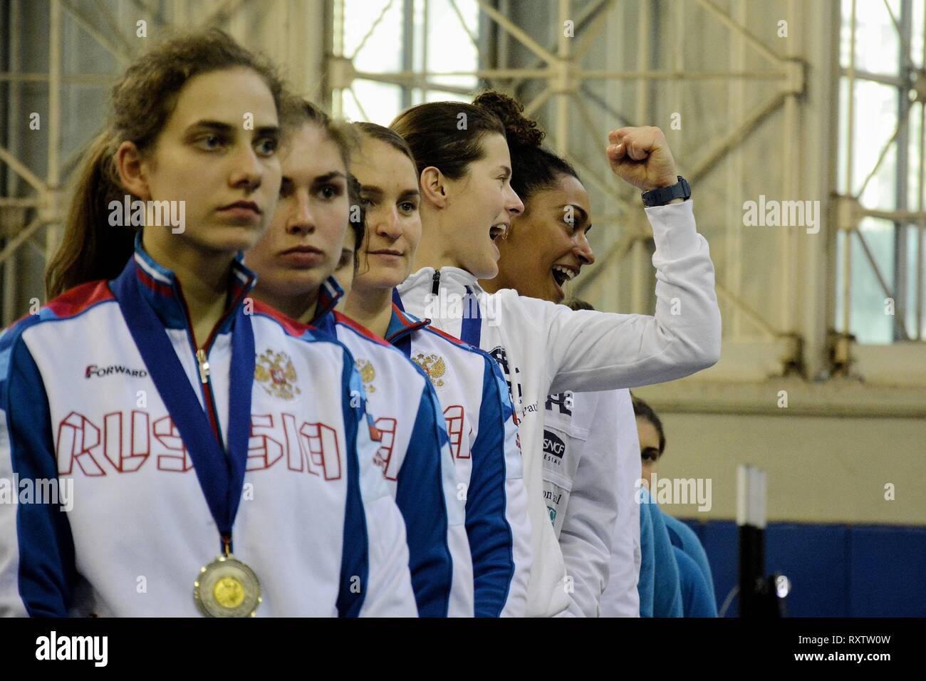 Athletes of Women's fencing team of  France are seen singing the national anthem after winning at the teams final of International fencing tournament Acropolis Coupe 2019. Stock Photo
