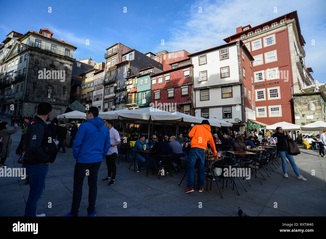Tourists and locals seen seating at bars in the historical neighbourhood of Ribeira. In 2018, Porto entered the list of the 100 most visited cities in the world in a ranking prepared by Euromonitor International. In 2018 it is estimated that the number of tourists reached 2.39 million. Stock Photo
