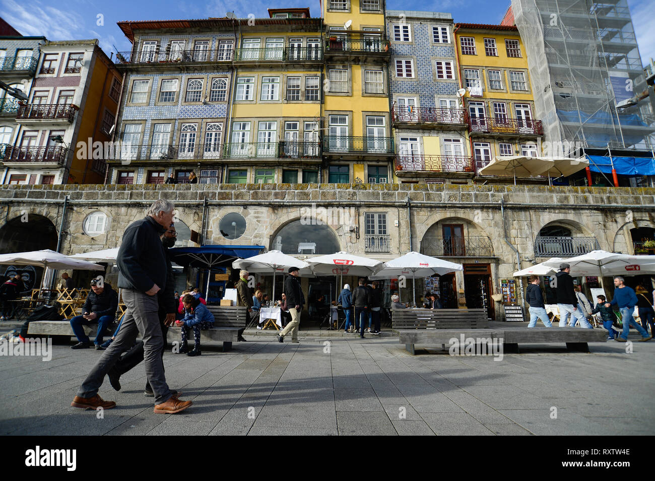 Tourists and locals seen walking with in the historical neighbourhood of Ribeira. In 2018, Porto entered the list of the 100 most visited cities in the world in a ranking prepared by Euromonitor International. In 2018 it is estimated that the number of tourists reached 2.39 million. Stock Photo