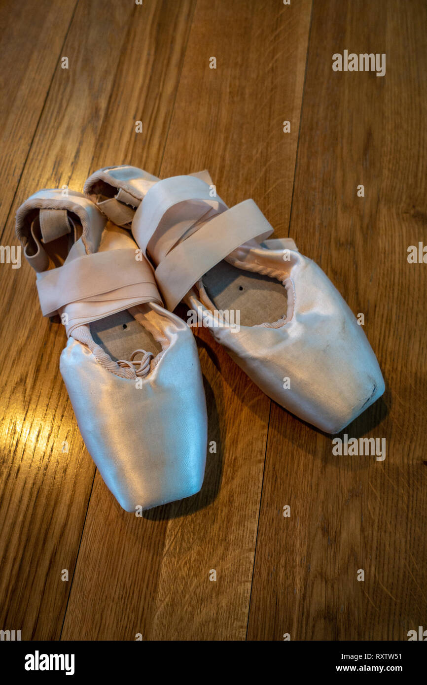 Classical Ballet pointe shoes, Ballerinas Pointe Shoes on a wooden