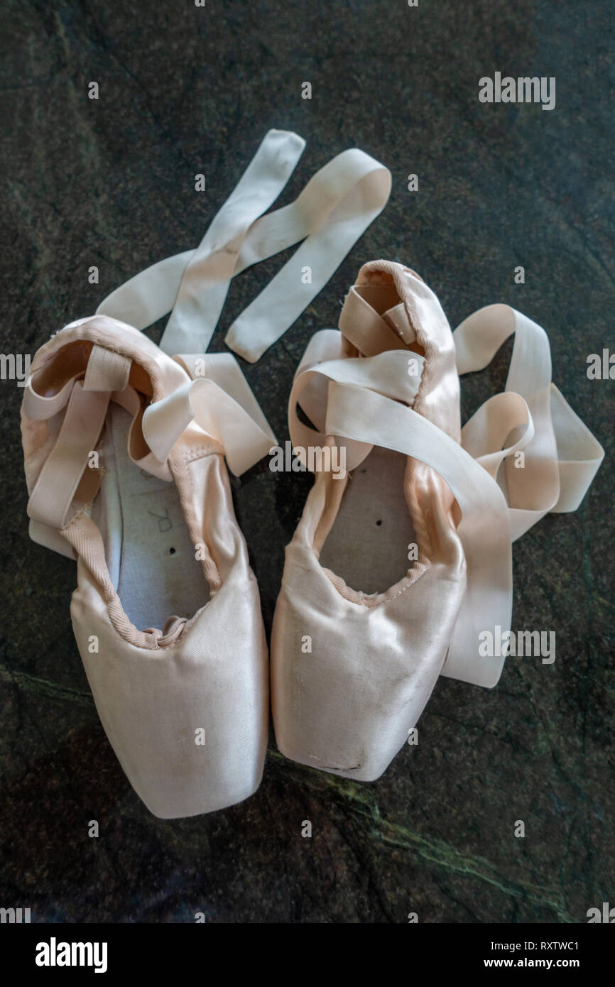 Classical Ballet pointe shoes, Ballerinas and Pointe Shoes on a marble  floor Stock Photo - Alamy