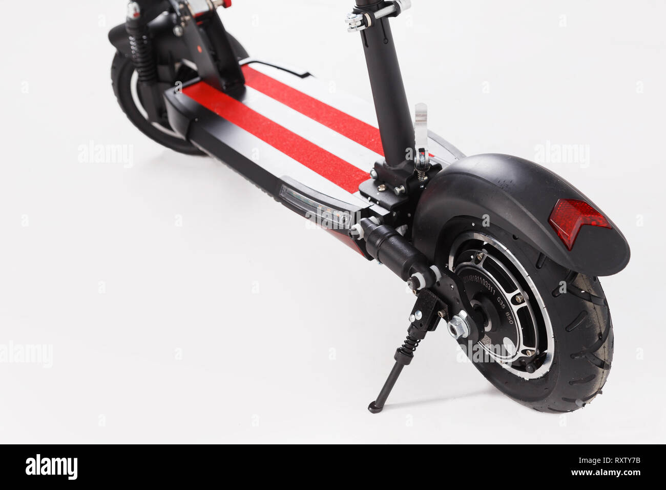 Electric scooter rear wheel with headlight on white Stock Photo Alamy