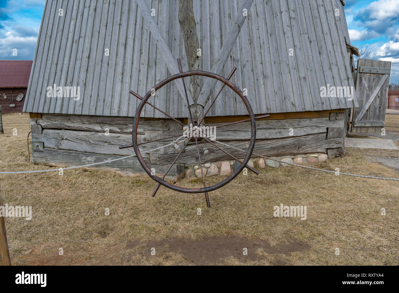 old mill for grinding grain in flour museum exhibit of Belarus Stock