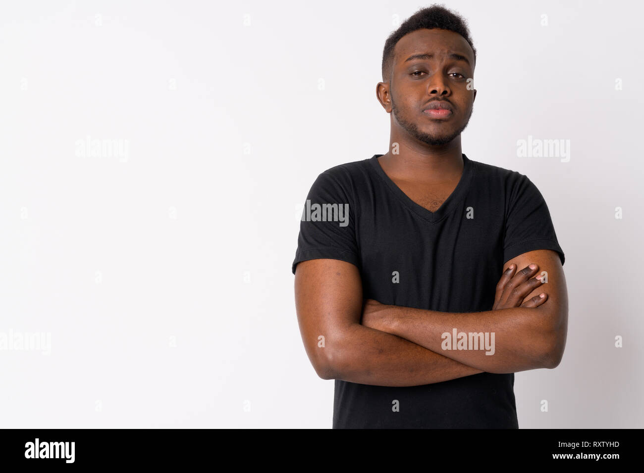 Portrait of young African man with arms crossed Stock Photo - Alamy