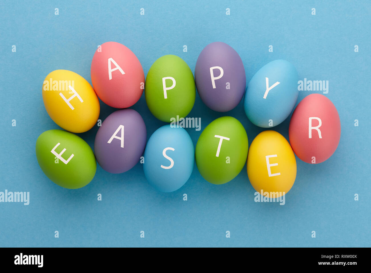 Painted eggs arranged in Happy Easter greeting Stock Photo
