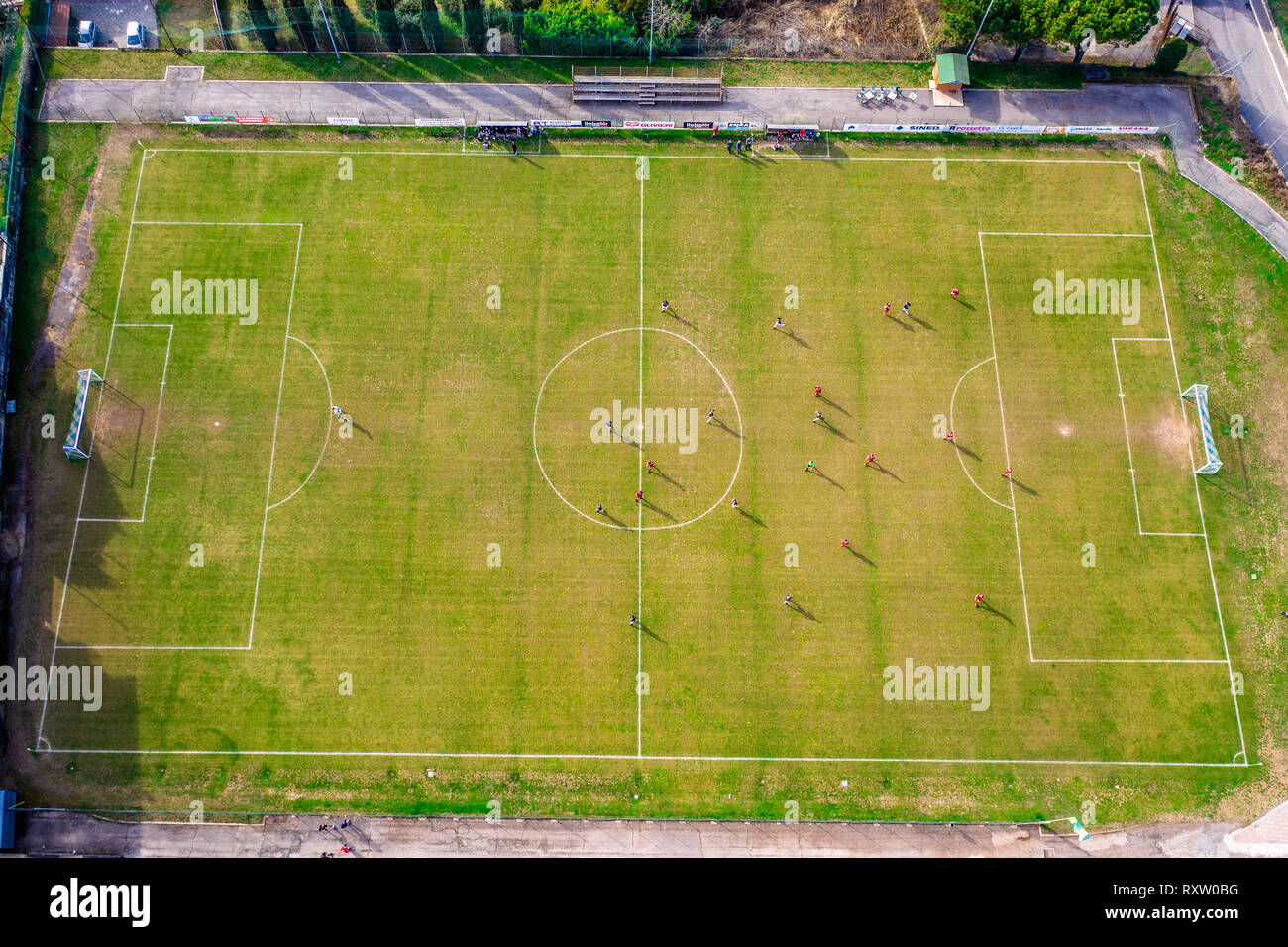 Top view from drone of football soccer field- Two teams playing a match and having a competition Stock Photo