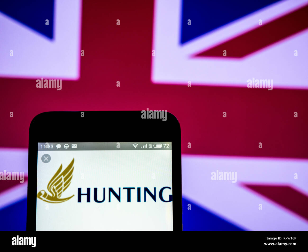 Hunting plc company logo seen displayed on smart phone Stock Photo Alamy