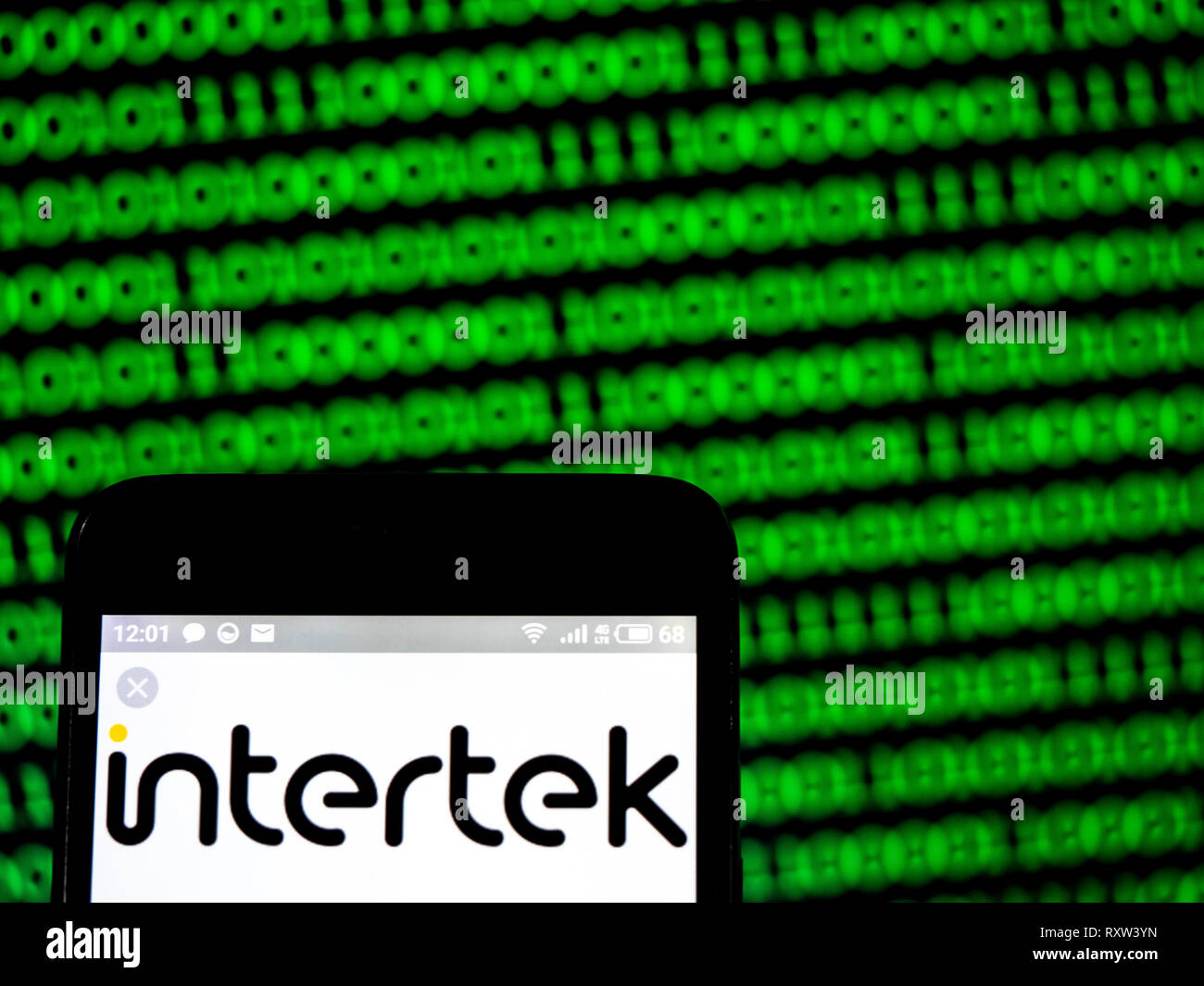 Intertek Group plc company logo seen displayed on smart phone Stock ...