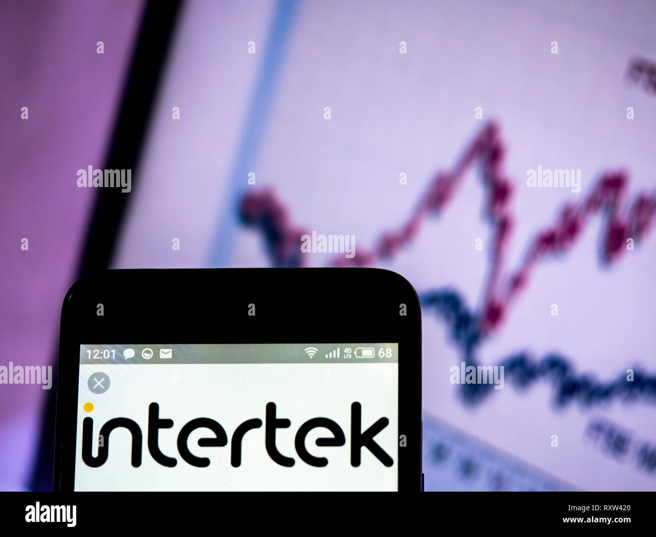 Intertek Group plc company logo seen displayed on smart phone Stock ...