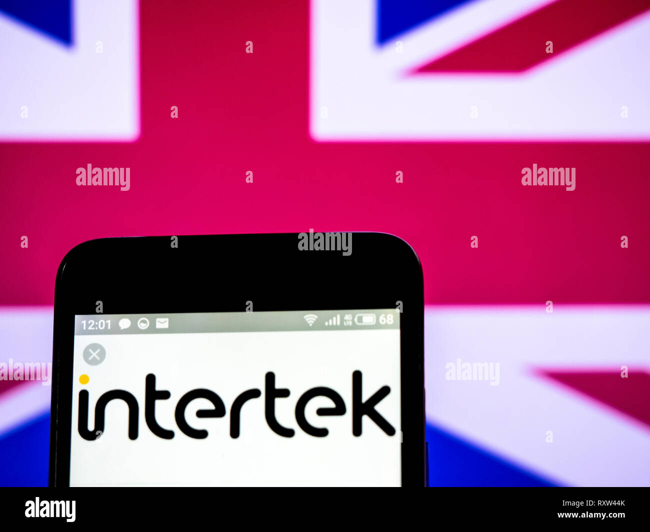 Intertek Group plc company logo seen displayed on smart phone Stock ...