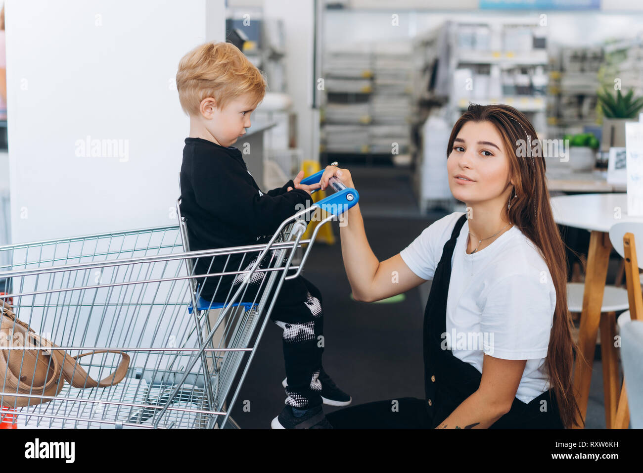 Budva, Montenegro - 17 march 2021: A child with a small trolley in the  supermarket, go shopping with his mother. The family goes shopping Stock  Photo - Alamy