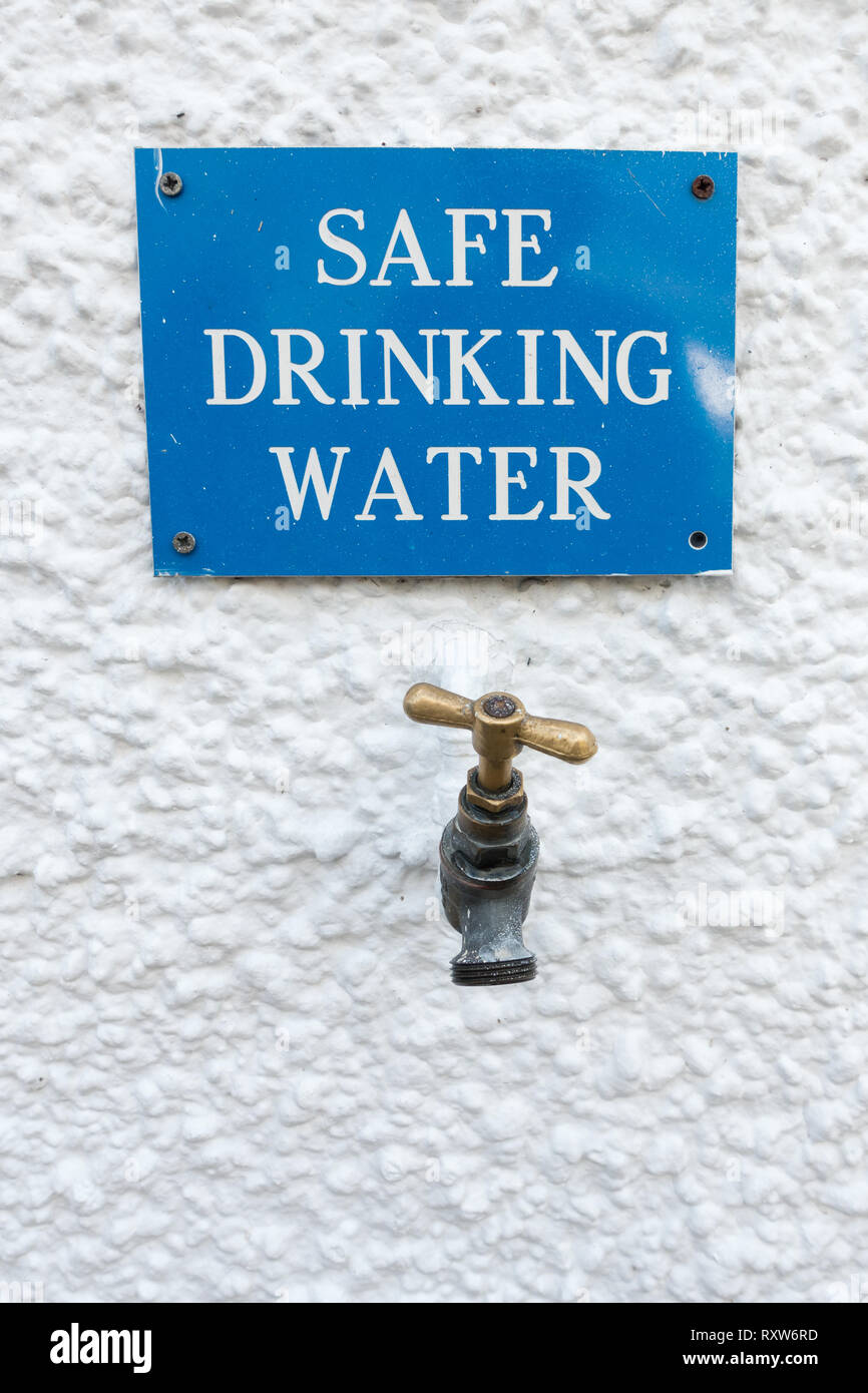 Safe Drinking Water tap and sign outside the Bridge of Orchy Hotel on the West Highland Way, Bridge of Orchy, Argyll, Scotland, UK Stock Photo