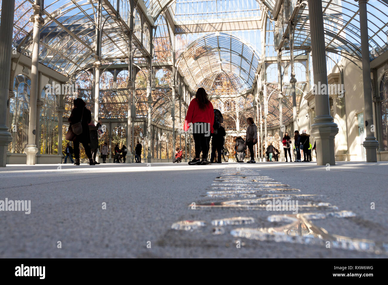 People visit the installation inside Crystal Palace located in Retiro Park. Madrid. Spain Stock Photo