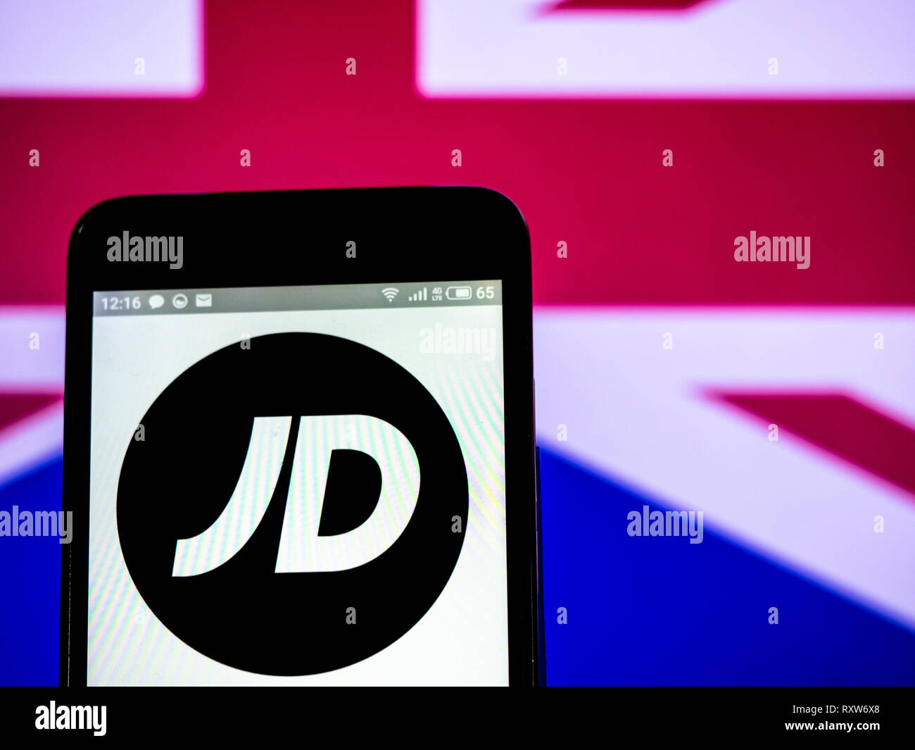 JD Sports Fashion plc company logo seen displayed on smart phone Stock