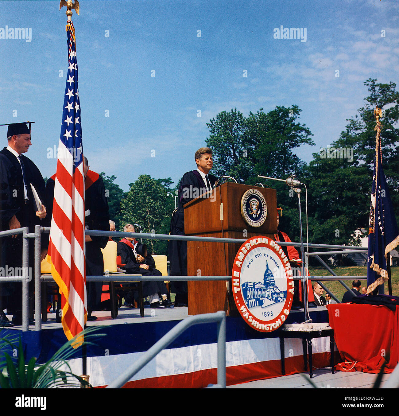 President John F Kennedy speaking at th Commencement Address at American University. Washington, D. C., American University, John M. Reeves Athletic Field. June 1963 Stock Photo