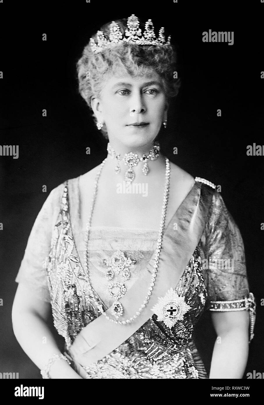 Queen Mary in tiara and gown wearing a choker necklace and a string of pearls- Mary of Teck was the Queen of the United Kingdom and Empress of India as the wife of George V. Before his accession, she was successively Duchess of York, Duchess of Cornwall and Princess of Wales. Stock Photo