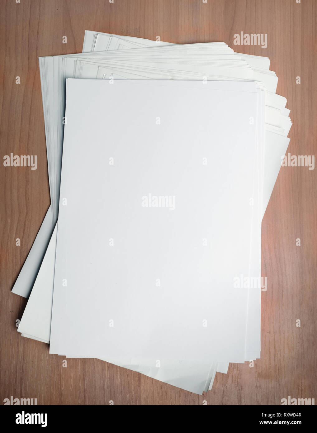 Stack white paper template on work table with Clipping Path Stock Photo