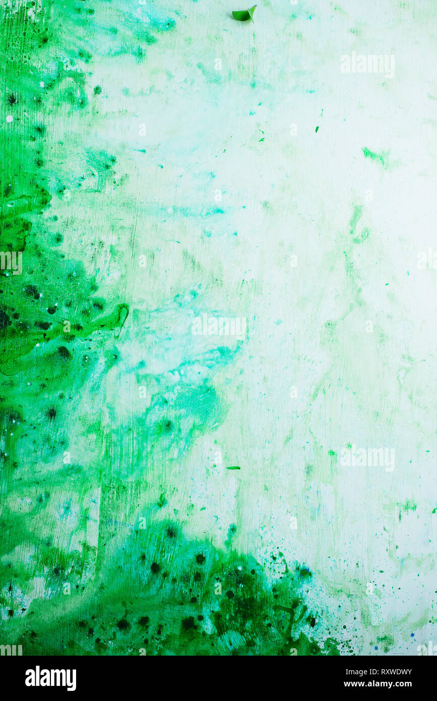 Green watercolor texture on a white background, acrylic base. Spring palette with copy space Stock Photo