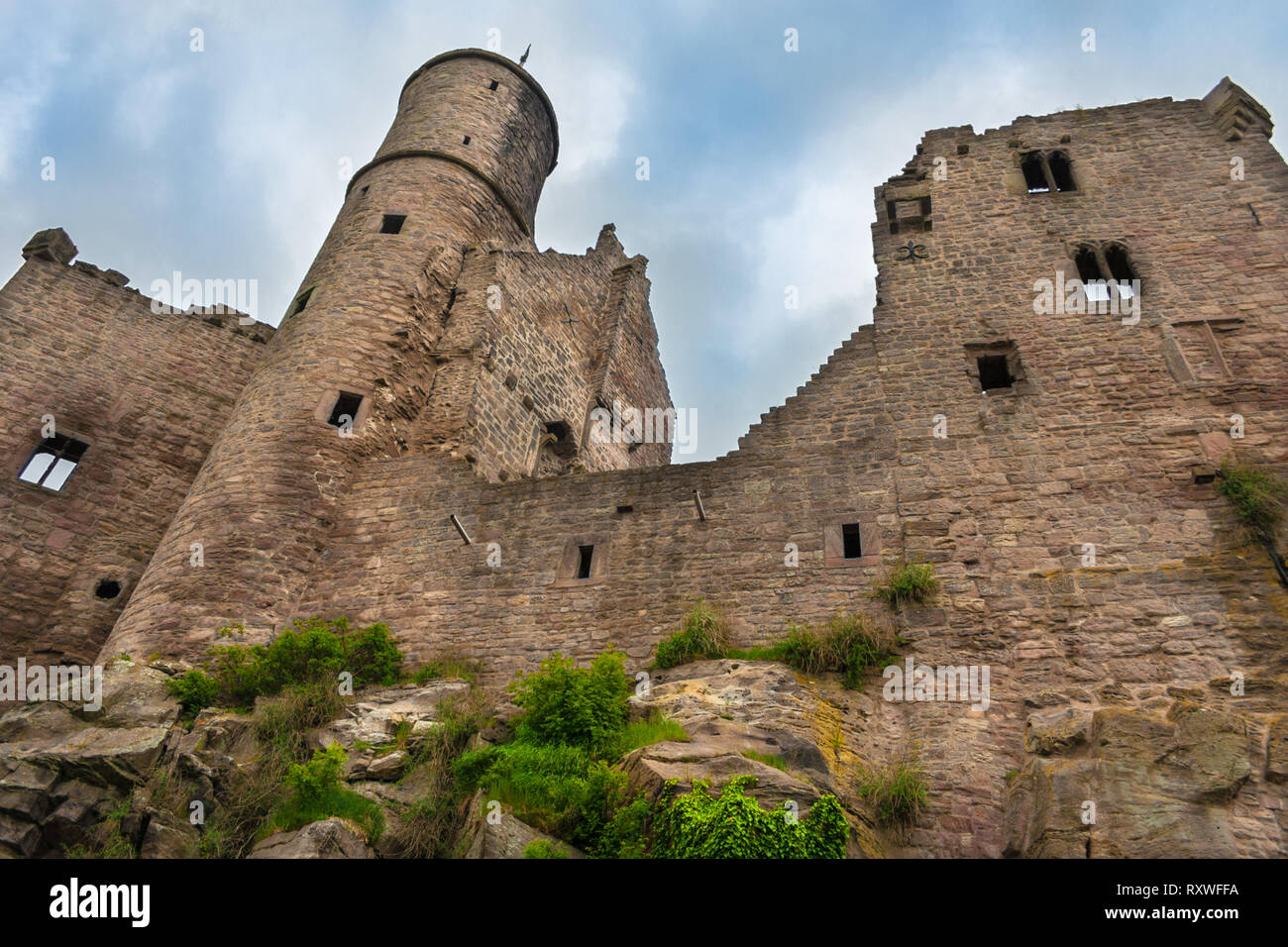 Impressive low-angle view of the south-western side of Hanstein Castle, one of the largest castle ruins in Central Germany. In its present extent it... Stock Photo