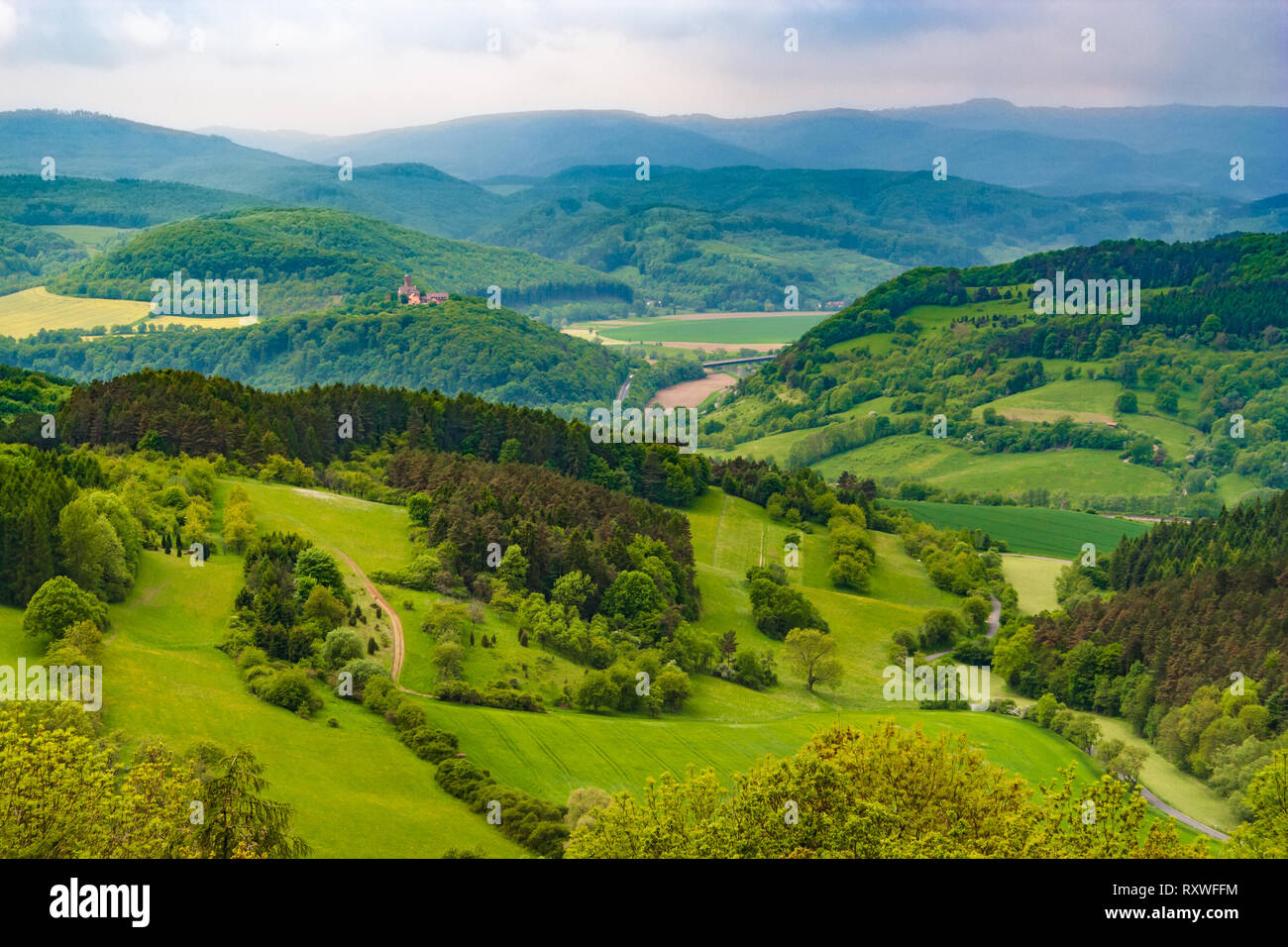 Great panoramic landscape view at Hanstein Castle ruin which is surrounded by beautiful woodland, the Werra Valley and the Hessian low mountains. On... Stock Photo