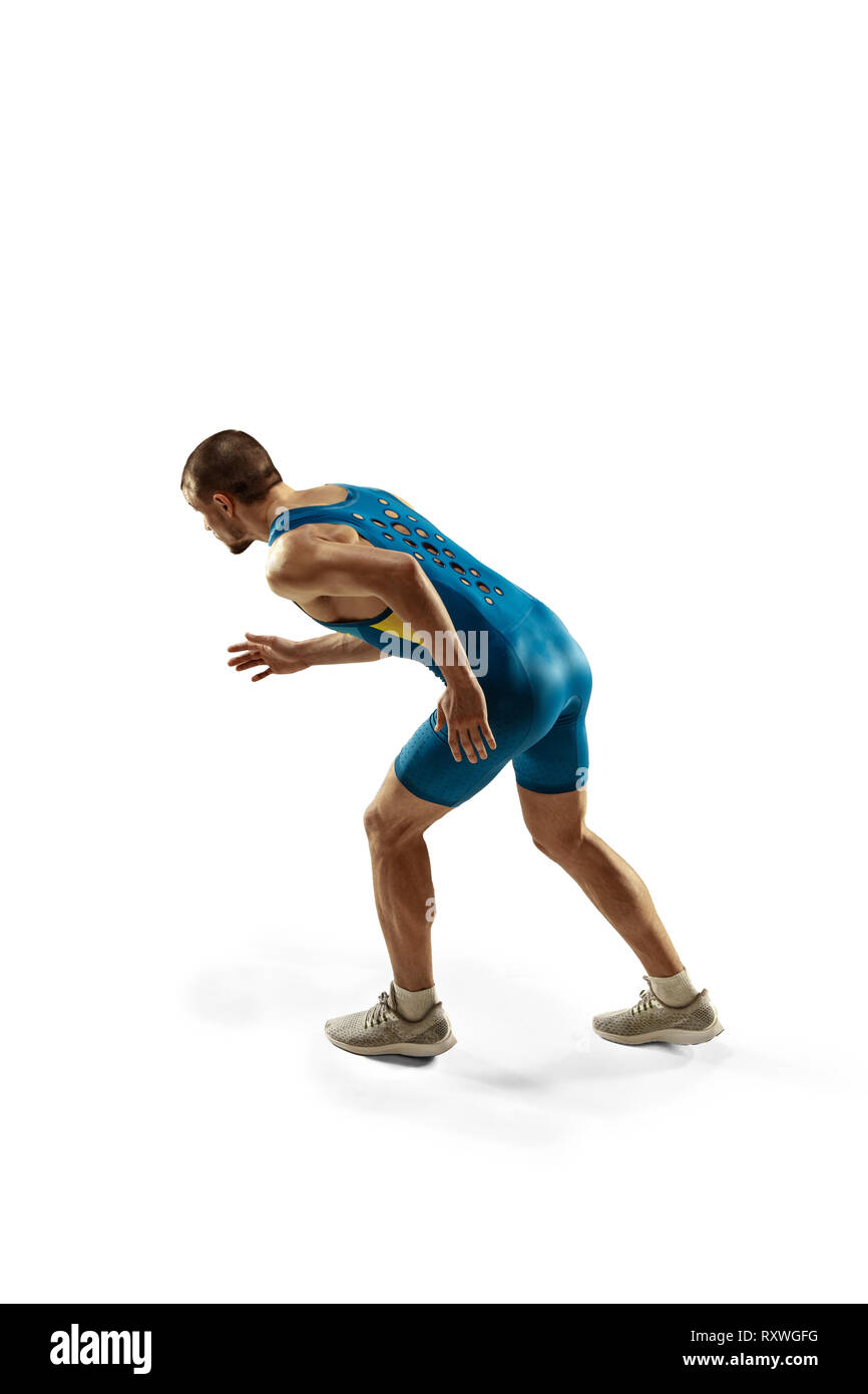 Young caucasian man preparing to run isolated on white studio ...