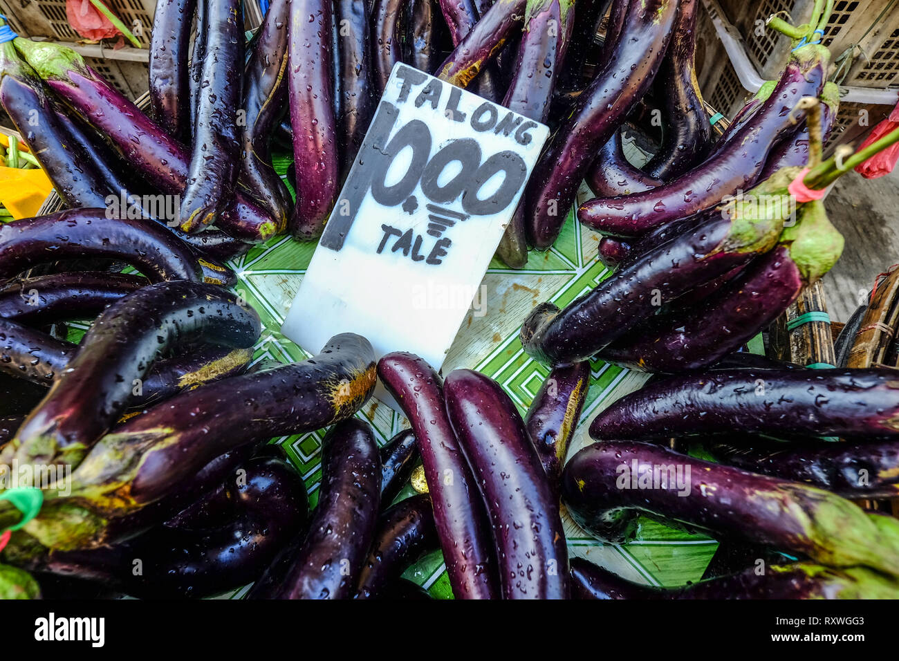 Pile of eggplants at rural market in Manila, Philippines Stock Photo