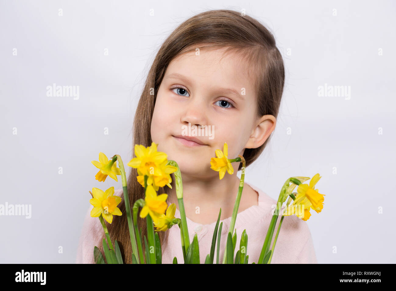 girl with yellow daffodils Stock Photo Alamy