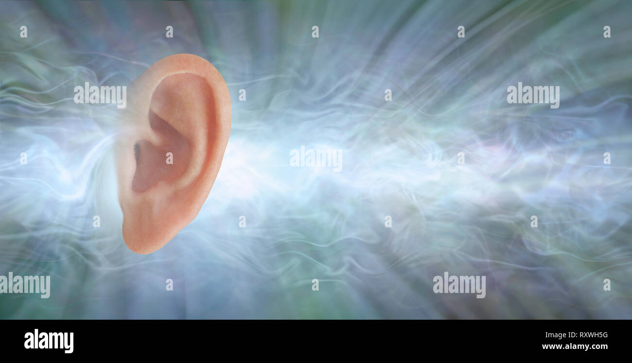 Audiology - if you could see what sound looks like - single flat profile of a human ear isolated against a jade coloured radiating flowing sound waves Stock Photo