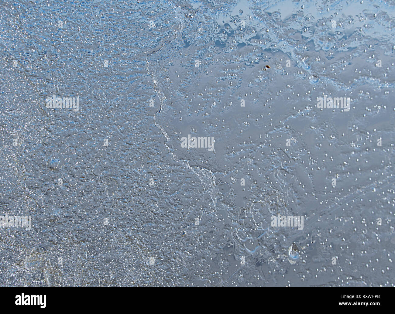 Sun rays caught in cracks in ice piece. Broken floe turn against to ...