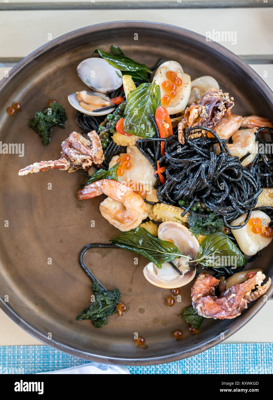 The Mediterranean delicacy food. Black seafood pasta spaghetti with