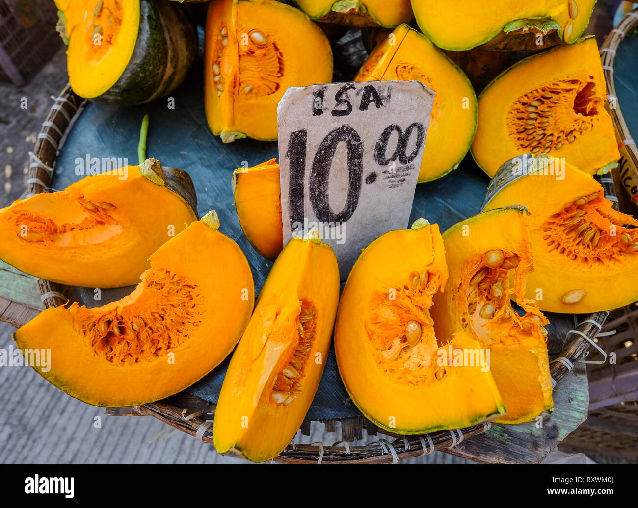Slice of yellow pumpkin at rural market in Manila, Philippines Stock ...