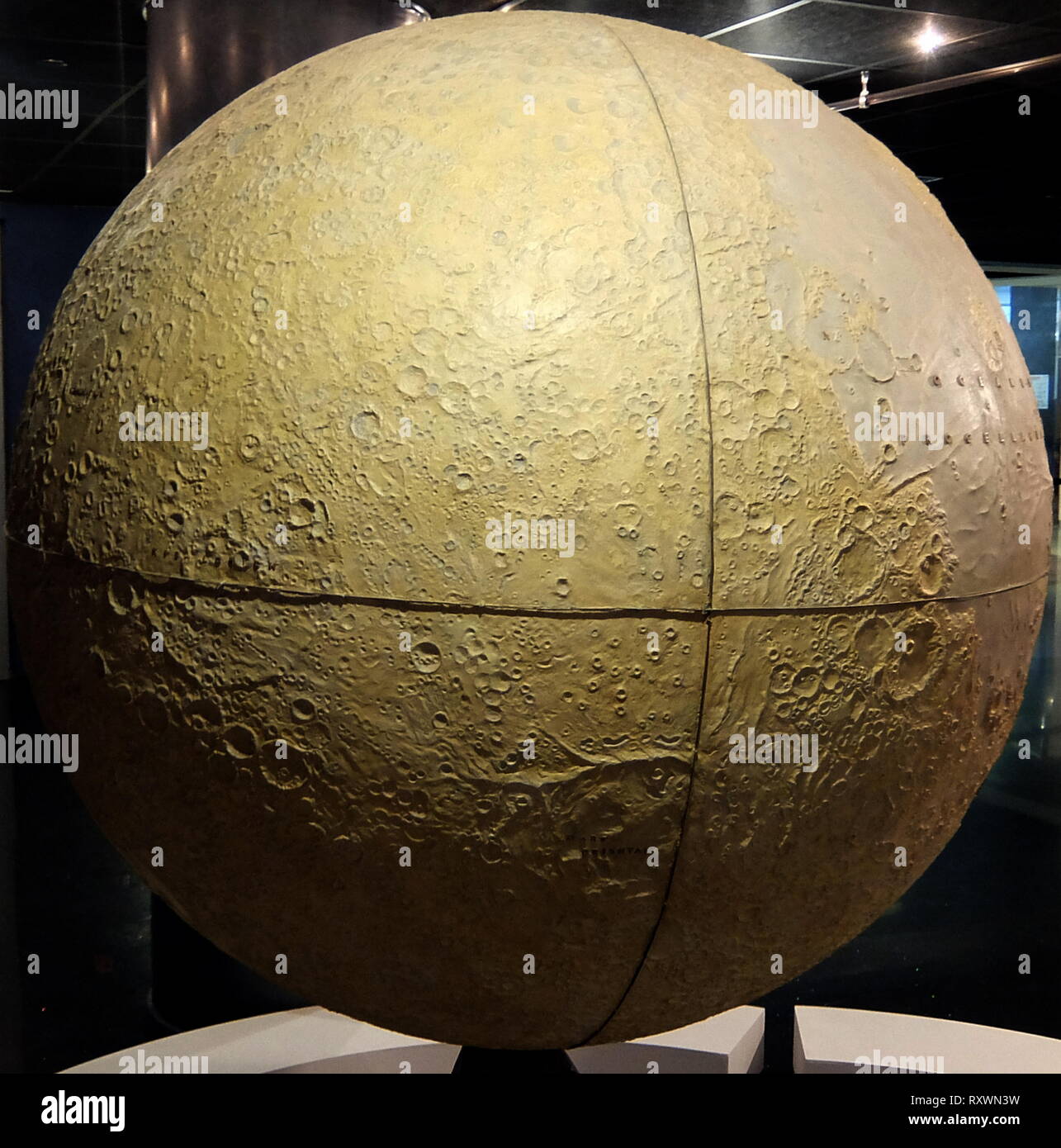 Moon Globe, based on images from automatic stations Luna-3, Zond-4, Zond-5, Zond-6, Zond-7 and Zond-8. The Soviet automatic station Luna-3 was the first to return images of the lunar far side on October 7, 1959. Signal acquisition was carried out in Crimea, Simeiz Observatory. Between 1965 and 1970 spacecraft Zond-4 - Zond-8 continued exploration of the Moon and obtained photographs from a distance of 1500 km and 9500 km. The first map of the lunar far sidewith hundreds of surface details identified by their reflection characteristics was based on collected materials. Full catalog of these det Stock Photo