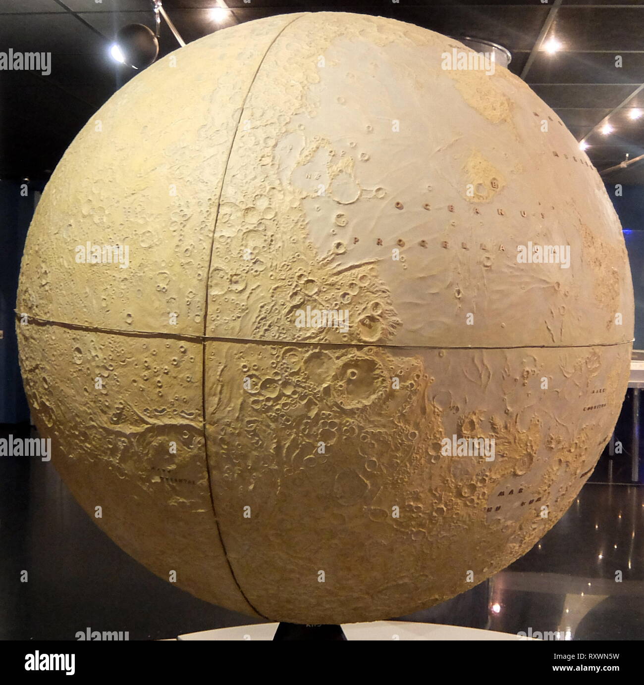 Moon Globe, based on images from automatic stations Luna-3, Zond-4, Zond-5, Zond-6, Zond-7 and Zond-8. The Soviet automatic station Luna-3 was the first to return images of the lunar far side on October 7, 1959. Signal acquisition was carried out in Crimea, Simeiz Observatory. Between 1965 and 1970 spacecraft Zond-4 - Zond-8 continued exploration of the Moon and obtained photographs from a distance of 1500 km and 9500 km. The first map of the lunar far sidewith hundreds of surface details identified by their reflection characteristics was based on collected materials. Full catalog of these det Stock Photo