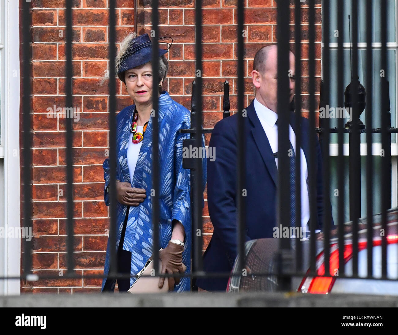 Prime Minister Theresa May leaves from the rear entrance of Downing Street, London, after she said the meaningful vote on Tuesday on her Brexit deal will go ahead. Stock Photo