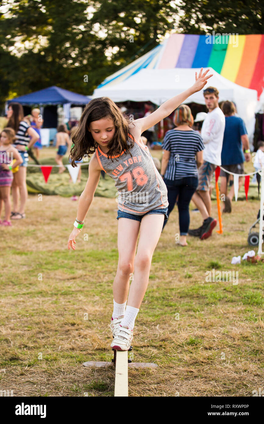 Kids tightrope walking circus workshop at Into the Wild festival, Kent, UK Stock Photo