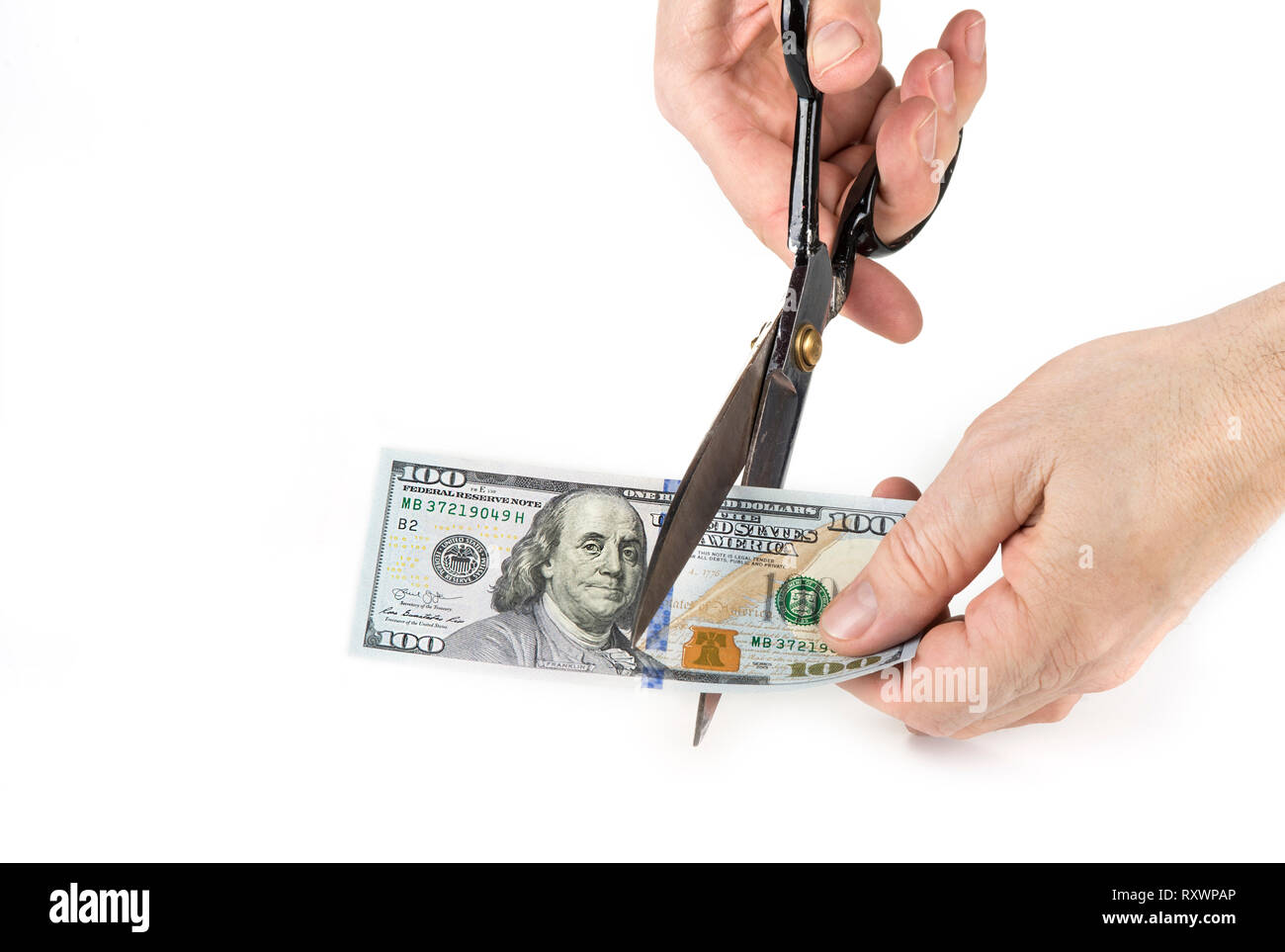 Paper money cut with scissors. Devaluation concept Stock Photo - Alamy