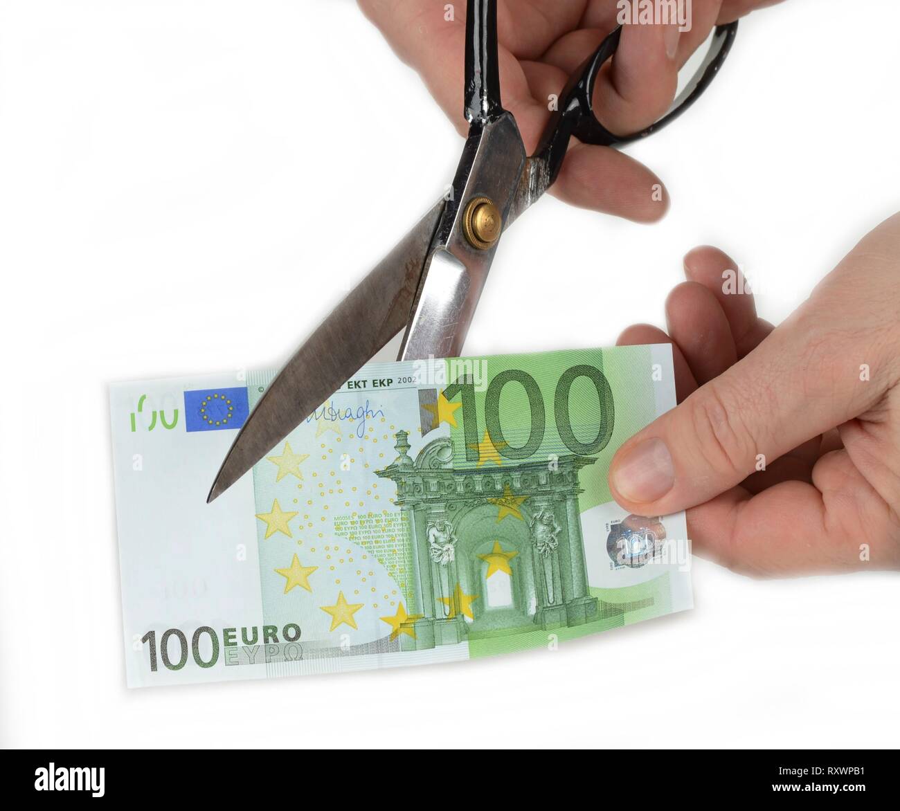 Paper money cut with scissors. Devaluation concept Stock Photo - Alamy
