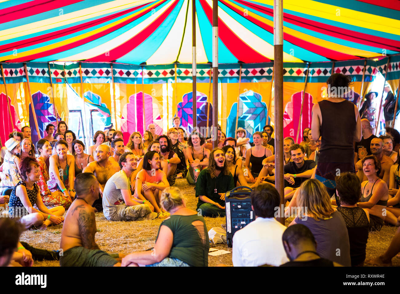 Large group of people attending a workshop at Into the Wild festival, Kent, UK Stock Photo
