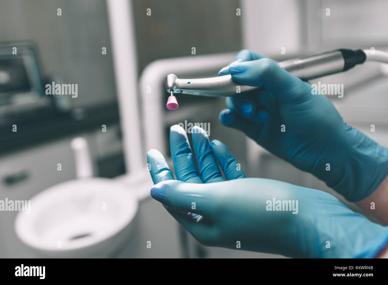 detail-of-hand-holding-dental-tools-in-dental-clinic-dentist-concept