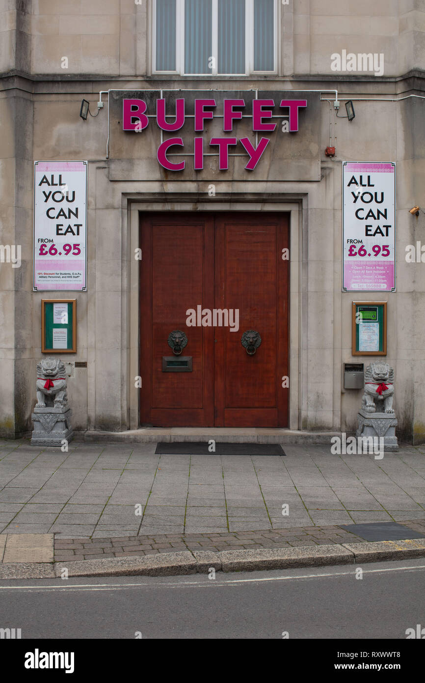 A shot of the front door of Buffet City in Plymouth with there all you can eat sign. Stock Photo
