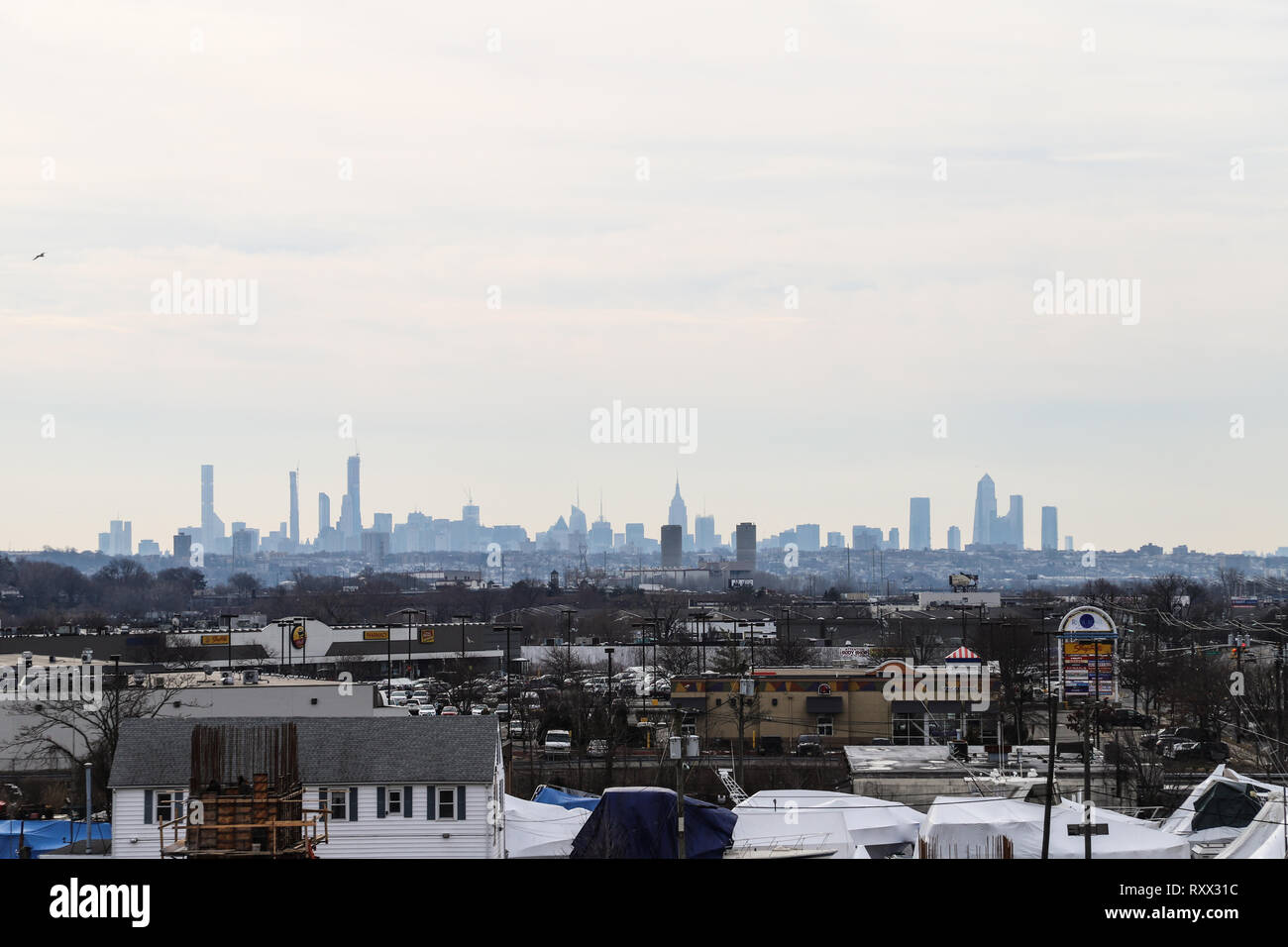 A photo of NYC from very far away on a highway. Travelling down south i-95 Stock Photo