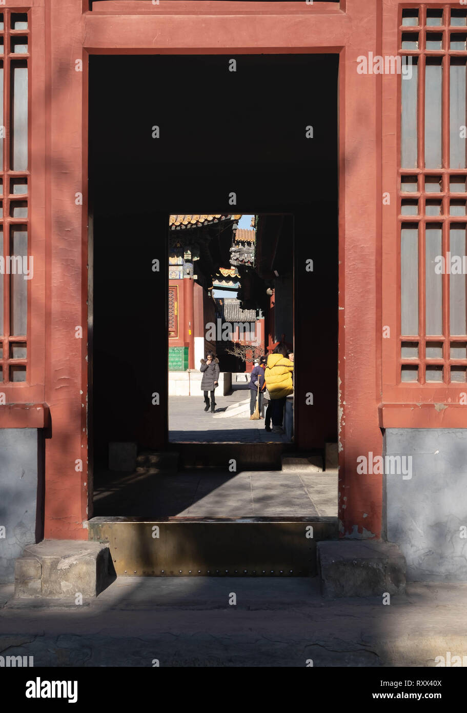 BEIJING/CHINA-JANUARY 17 2019: The old traditional chinese door. It’s the symbol of the Chinese interior.  Yonghe temple, Lama temple , Beijing China. Stock Photo