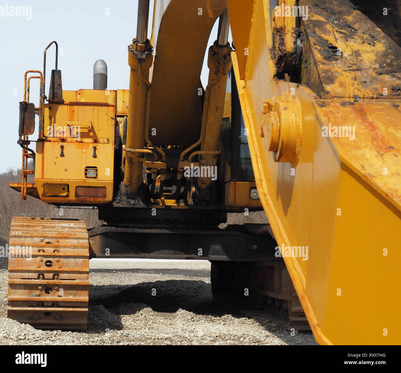 Yellow excavator with extended boom construction equipment Stock Photo