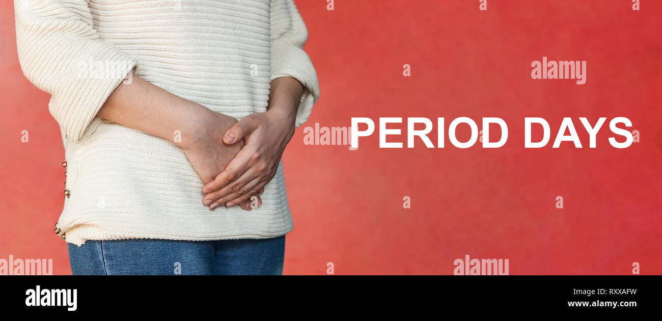 The concept of painful menstruation days. Woman with hands over the stomach. Menstruation or Period days concept. Monthly painful days with text: Peri Stock Photo