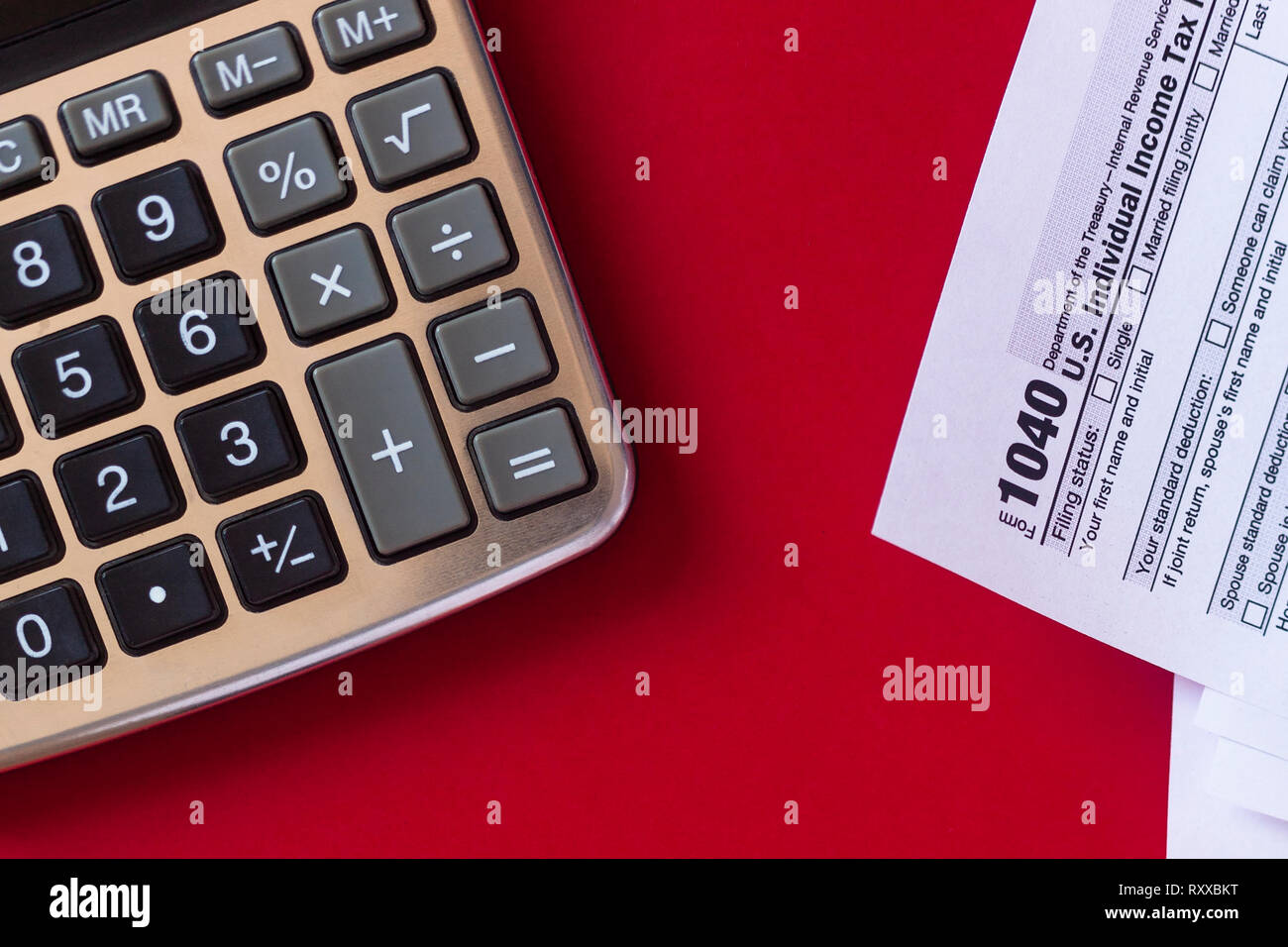 us tax form 1040 with calculator on red background copy payslip calculator usa