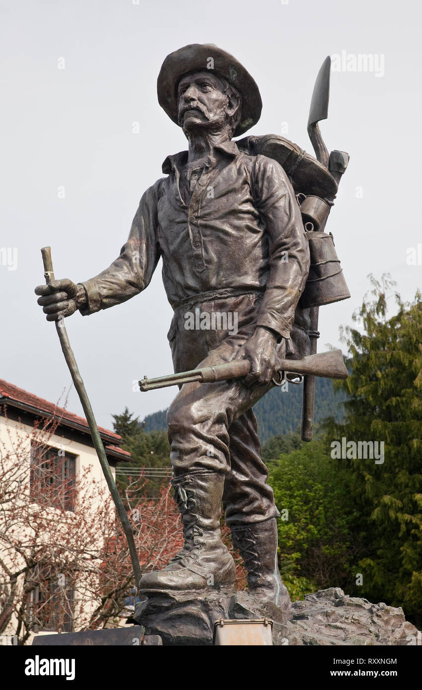 Bronze statue entitled 'The Prospector' by sculptor Alonzo Victor Lewis in front of the Pioneer Home in Sitka, Alaska, USA Stock Photo