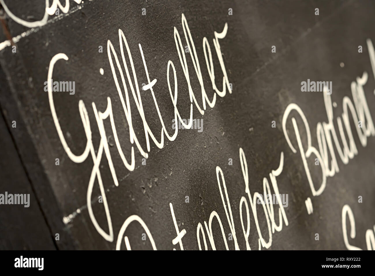 Menu in front of a restaurant with the inscription 'mixed grill' Stock Photo