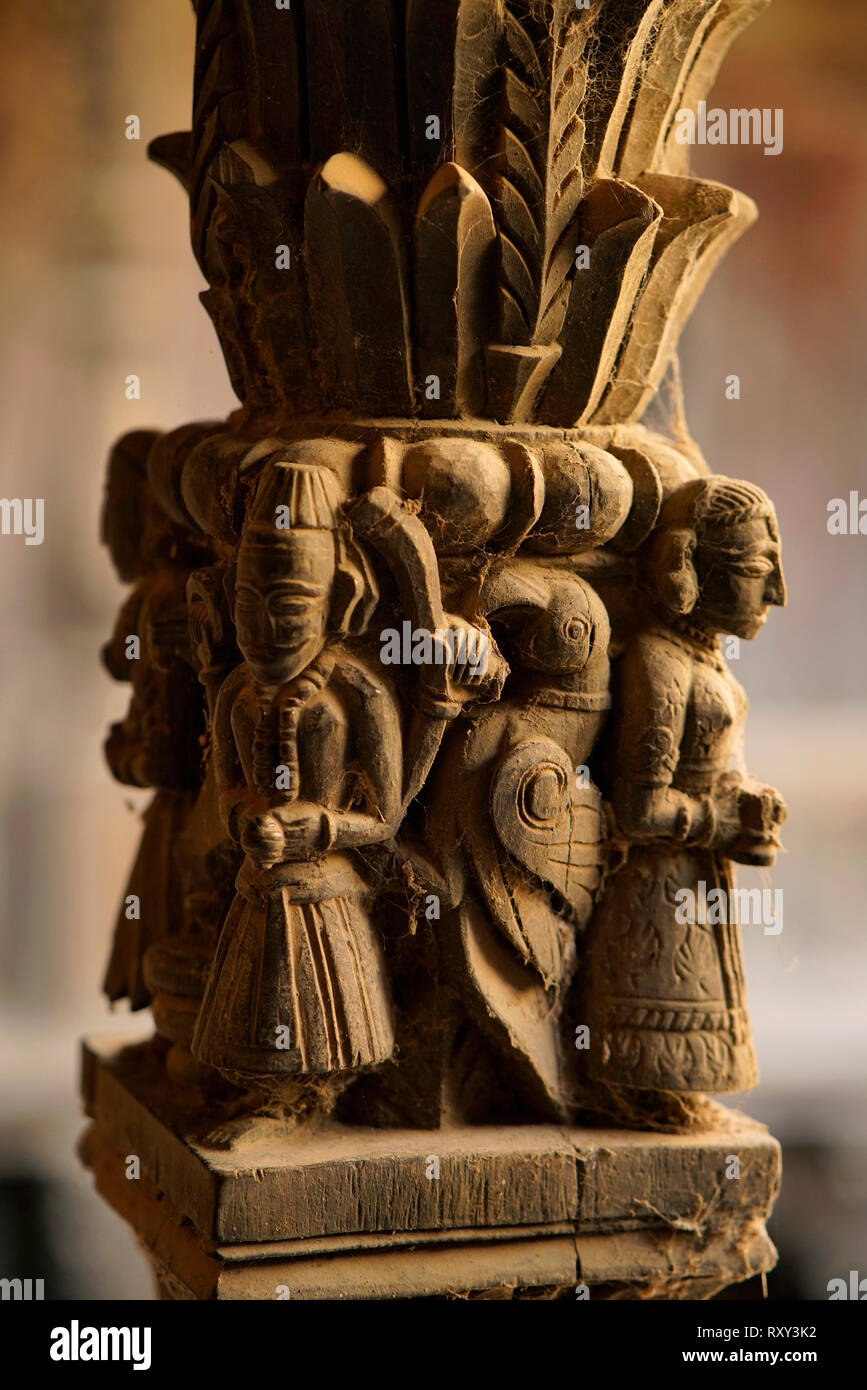 Statues of deity carved out of wood that forms part of pillars supporting balcony, Palashikar wada, Palashi, Ahmednagar. Stock Photo