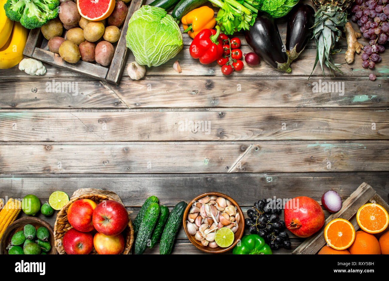 Organic food. Fresh fruits and vegetables. On a wooden background. Stock Photo