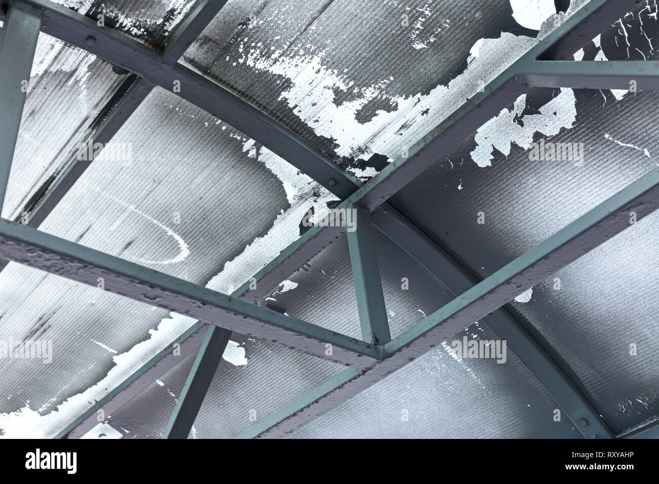 old glass industrial ceiling with metal beams, closeup view. abstract background Stock Photo